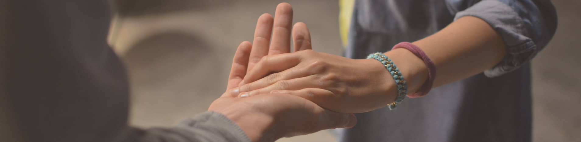 People holding hands and leading each other